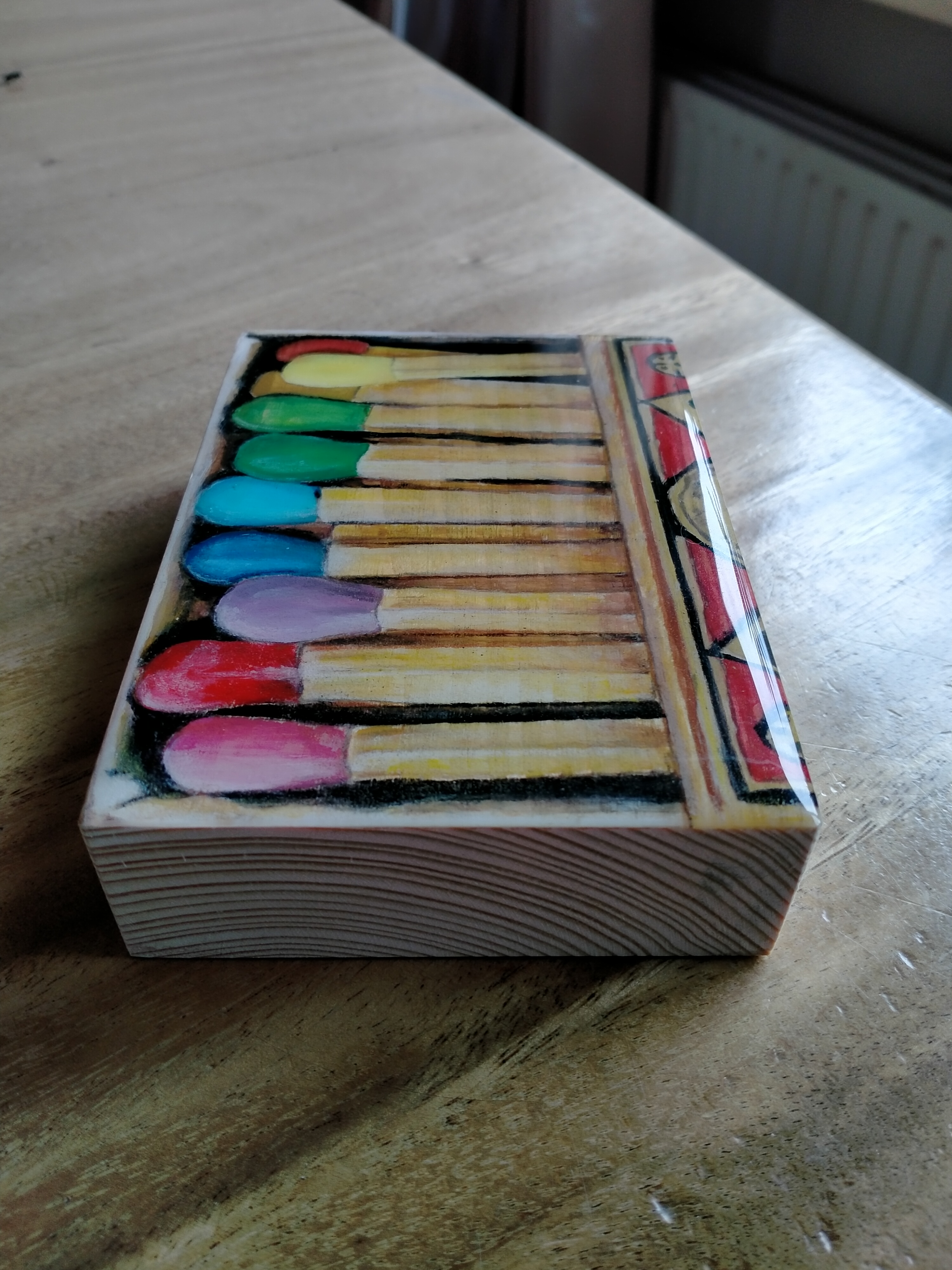 op blokje steigerhout 13 x 9 cm 
lucifers € 15,--